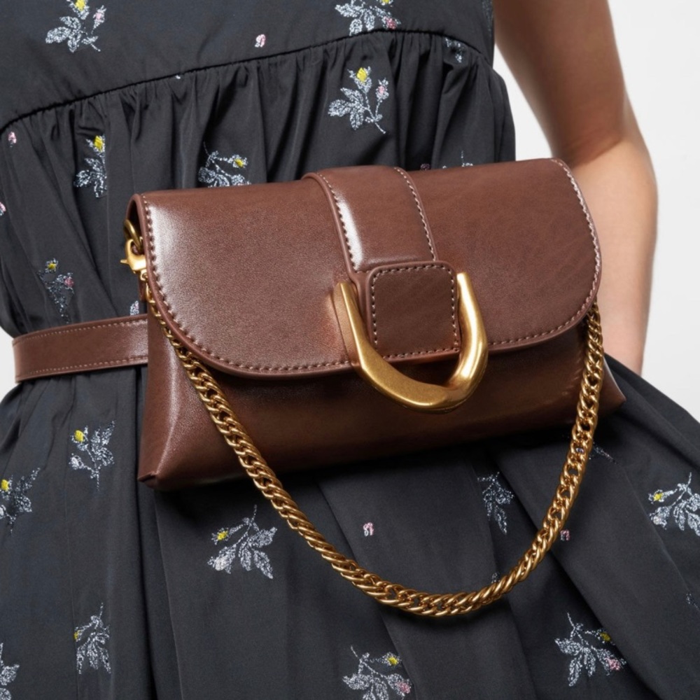 Great condition! Can be worn as a belt bag, crossbody, or clutch.